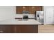 Modern kitchen with stainless steel appliances and a large island sink at 607 Silverado Sunset Loop, Wendell, NC 27591