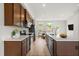 Bright kitchen with stainless appliances and quartz countertops are great for cooking at 607 Silverado Sunset Loop, Wendell, NC 27591