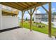 Covered patio with concrete floor and wooden support beams at 607 Silverado Sunset Loop, Wendell, NC 27591