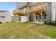 Backyard view showcasing the wooden decks, white fence, and newly installed grass at 609 Silverado Sunset Loop, Wendell, NC 27591