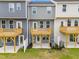 Backyard view showcasing the decks, white fences, and well-maintained lawns at 609 Silverado Sunset Loop, Wendell, NC 27591