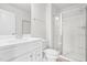 Well-lit bathroom featuring a vanity with a sink, toilet, and a glass-enclosed shower at 609 Silverado Sunset Loop, Wendell, NC 27591