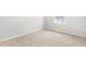 Bright bedroom showcasing neutral carpet and a window that brings in natural light at 609 Silverado Sunset Loop, Wendell, NC 27591