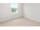 Cozy bedroom featuring a window with natural light and neutral carpet at 609 Silverado Sunset Loop, Wendell, NC 27591