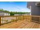 Spacious wooden deck with wood railings provides serene outdoor living space at 609 Silverado Sunset Loop, Wendell, NC 27591