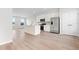 Open layout kitchen featuring an island, stainless appliances, and bright light at 609 Silverado Sunset Loop, Wendell, NC 27591