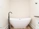 Bathroom features a modern white soaking tub and black fixtures at 610 Peele St, Burlington, NC 27215