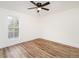 Bedroom with a window and light wood flooring at 610 Peele St, Burlington, NC 27215
