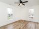 Bedroom with ceiling fan and natural light from two windows at 610 Peele St, Burlington, NC 27215