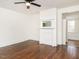Bedroom features fireplace and access to another room with white wainscoting at 610 Peele St, Burlington, NC 27215