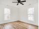 Bedroom with ceiling fan and natural light from two windows at 610 Peele St, Burlington, NC 27215