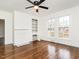 Living room features hardwood floors, a fireplace, built-in shelving, and multiple windows at 610 Peele St, Burlington, NC 27215
