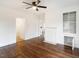 Bright, open-concept living room with hardwood floors, fireplace, built-in shelves, and great natural light at 610 Peele St, Burlington, NC 27215