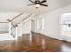 Spacious living room with staircase, hardwood floors, fireplace and abundant natural light at 610 Peele St, Burlington, NC 27215
