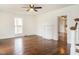 Spacious living room with hardwood floors, a decorative fireplace, and a bright window at 610 Peele St, Burlington, NC 27215