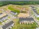 Aerial view of homes, new construction and open lots in planned community at 611 Silverado Sunset Loop, Wendell, NC 27591