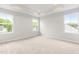 Bedroom with tray ceilings, recessed lights, and three bright windows at 611 Silverado Sunset Loop, Wendell, NC 27591