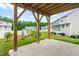 Concrete patio beneath a wooden deck and overlooks the green backyard and neighborhood at 611 Silverado Sunset Loop, Wendell, NC 27591