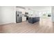 Spacious open-concept kitchen featuring stainless steel appliances, central island, and sleek countertops for easy living at 611 Silverado Sunset Loop, Wendell, NC 27591