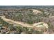 An aerial view of a golf course in a residential community at 7100 Hasentree Club Dr, Wake Forest, NC 27587