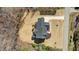 Overhead shot of a beautiful home highlighting its roof, deck, landscaping, and surrounding property at 7100 Hasentree Club Dr, Wake Forest, NC 27587