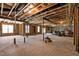 Unfinished basement with framed walls, exposed ceiling, and concrete flooring at 7100 Hasentree Club Dr, Wake Forest, NC 27587