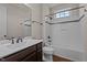 Bathroom featuring a tub-shower combo with stylish tile and a wood vanity at 7100 Hasentree Club Dr, Wake Forest, NC 27587