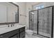 Modern bathroom featuring a stylish vanity, decorative tile in the glass enclosed shower, and updated fixtures at 7100 Hasentree Club Dr, Wake Forest, NC 27587