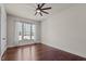 An empty bedroom with hardwood floors and a window with a view at 7100 Hasentree Club Dr, Wake Forest, NC 27587