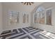 Bright bonus room features unique flooring and multiple windows providing ample natural light and beautiful views at 7100 Hasentree Club Dr, Wake Forest, NC 27587