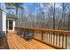 Spacious wooden deck with outdoor seating and beautiful views of the surrounding trees at 7100 Hasentree Club Dr, Wake Forest, NC 27587