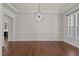 Spacious formal dining room with crown molding and hardwood floors at 7100 Hasentree Club Dr, Wake Forest, NC 27587