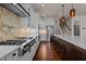 Well-lit kitchen featuring a gas range, stainless steel appliances, and granite countertops at 7100 Hasentree Club Dr, Wake Forest, NC 27587