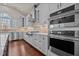 Updated kitchen with stainless steel appliances, modern cabinets, and a tiled backsplash at 7100 Hasentree Club Dr, Wake Forest, NC 27587