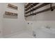Laundry room includes a utility sink, shelving, and vintage-style décor at 7100 Hasentree Club Dr, Wake Forest, NC 27587