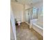 Bathroom with a bathtub, shower, and modern fixtures, offering a serene spa-like experience at 723 Whitt Town Rd Rd, Roxboro, NC 27574
