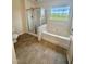Bathroom with a bathtub, shower, and modern fixtures, offering a serene spa-like experience at 723 Whitt Town Rd Rd, Roxboro, NC 27574