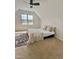 Bedroom featuring a bed with a patterned rug, a ceiling fan and a window at 723 Whitt Town Rd Rd, Roxboro, NC 27574
