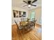 Inviting dining room with modern art, wood table with seating for six, and natural light at 723 Whitt Town Rd Rd, Roxboro, NC 27574