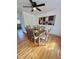 Inviting dining room with modern art, wood table with seating for six, and hardwood floors at 723 Whitt Town Rd Rd, Roxboro, NC 27574
