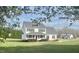 Charming two-story home boasts a welcoming porch and well-manicured lawn surrounded by mature trees at 723 Whitt Town Rd Rd, Roxboro, NC 27574