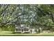 Lovely two-story home with a covered porch, surrounded by mature trees and a well-kept lawn at 723 Whitt Town Rd Rd, Roxboro, NC 27574