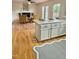 Bright kitchen featuring an island, stainless steel dishwasher, and ample cabinet space at 723 Whitt Town Rd Rd, Roxboro, NC 27574