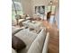 Cozy living room features stylish furniture, wood floors, and plenty of natural light from multiple windows at 723 Whitt Town Rd Rd, Roxboro, NC 27574