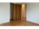 Bedroom featuring hardwood floors, closet, and view of other rooms; freshly renovated at 736 Core Rd Rd, Dunn, NC 28334