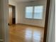 Bedroom featuring hardwood floors, a window for natural light, and closet at 736 Core Rd Rd, Dunn, NC 28334