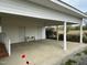 Large carport with white columns and ample space for parking or storage at 736 Core Rd Rd, Dunn, NC 28334