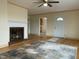 Spacious living room with brick fireplace, hardwood floors, and natural light at 736 Core Rd Rd, Dunn, NC 28334