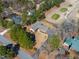 An aerial shot showcases the home's location near a golf course and surrounding trees at 7516 Mourning Dove Dr, Sanford, NC 27332
