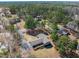 An aerial shot showcases this charming home nestled among mature trees in a quiet neighborhood at 7516 Mourning Dove Dr, Sanford, NC 27332